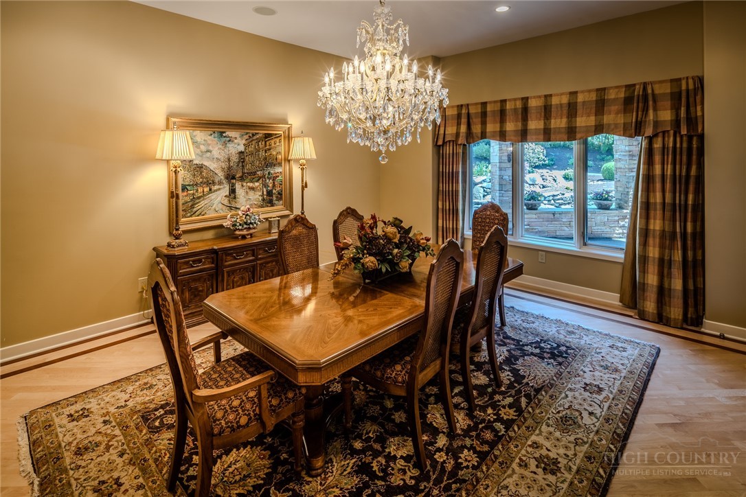 331 Branch Water Run Linville, NC 28646 - Photo 20 of 50 a dining room with furniture a rug and wooden floor