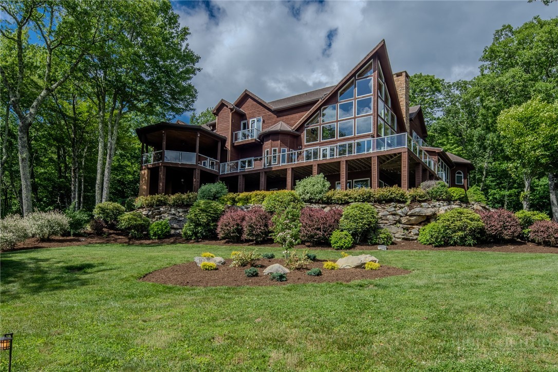331 Branch Water Run Linville, NC 28646 - Photo 2 of 50 a front view of a house with a yard and green space