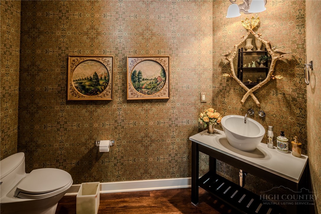 331 Branch Water Run Linville, NC 28646 - Photo 21 of 50 a bathroom with a toilet a sink and mirror