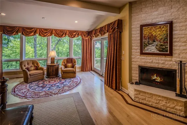 a living room with furniture and a large window