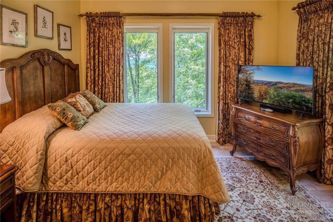 331 Branch Water Run Linville, NC 28646 - Photo 28 of 50 a bedroom with a bed and a flat screen tv