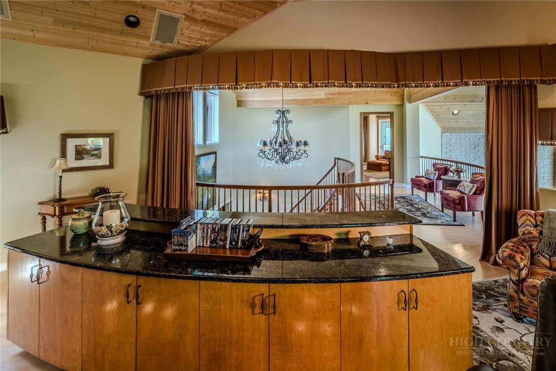 331 Branch Water Run Linville, NC 28646 - Photo 31 of 50 a kitchen with granite countertop a sink and a refrigerator