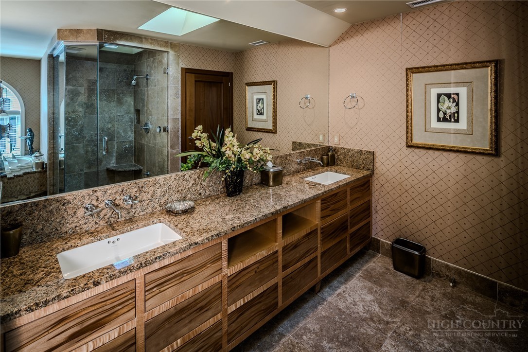 331 Branch Water Run Linville, NC 28646 - Photo 36 of 50 a bathroom with a granite countertop double vanity sink and a mirror
