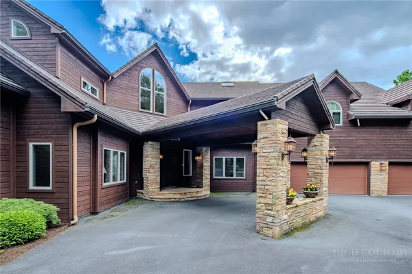 a front view of a house with a garage