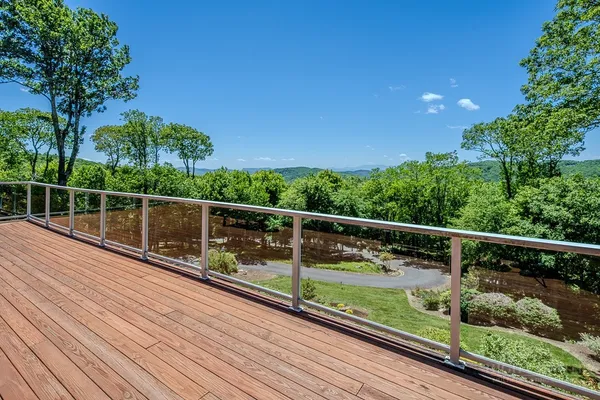 a kitchen with granite countertop a stove a sink and a refrigerator