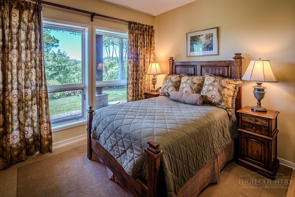 331 Branch Water Run Linville, NC 28646 - Photo 44 of 50 a bedroom with a bed and a night stand