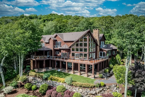 an aerial view of a house with mountain view