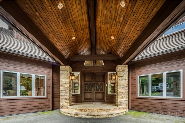 a view of entryway livingroom and hall with wooden floor
