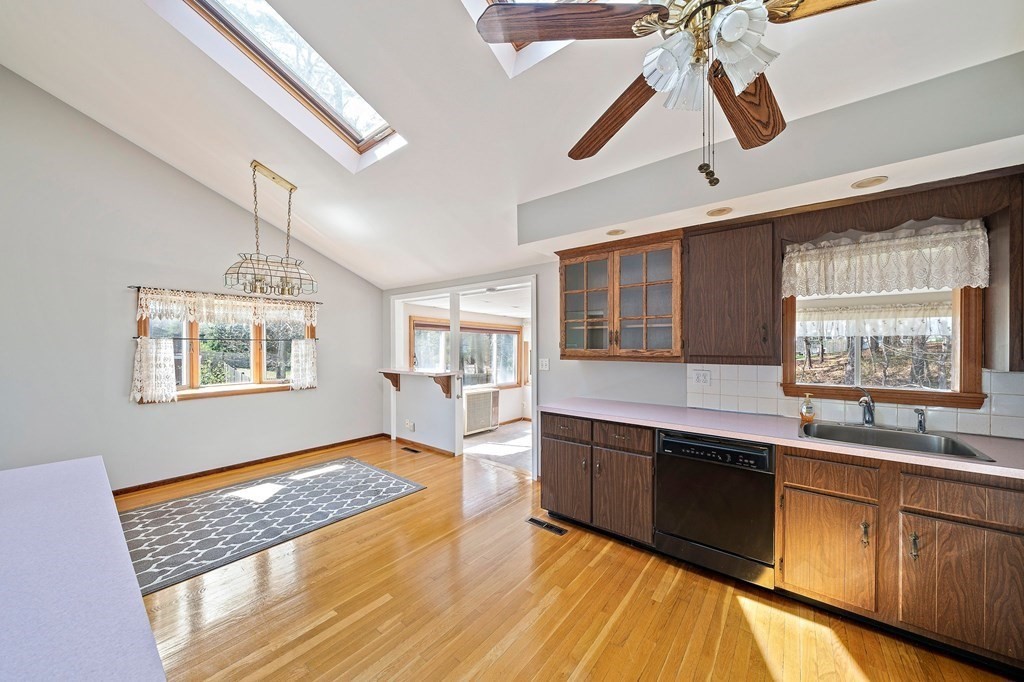 61 Orchard Road Marshfield, MA 02050 - Photo 11 of 33 a kitchen with stainless steel appliances granite countertop a stove sink and cabinets