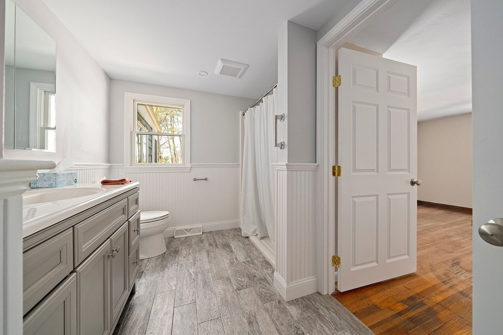 61 Orchard Road Marshfield, MA 02050 - Photo 19 of 33 a bathroom with a granite countertop sink toilet and shower