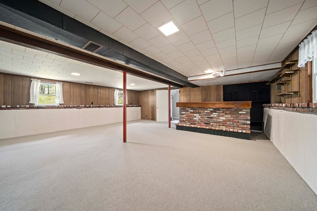 61 Orchard Road Marshfield, MA 02050 - Photo 26 of 33 a view of an empty room with a fireplace and window