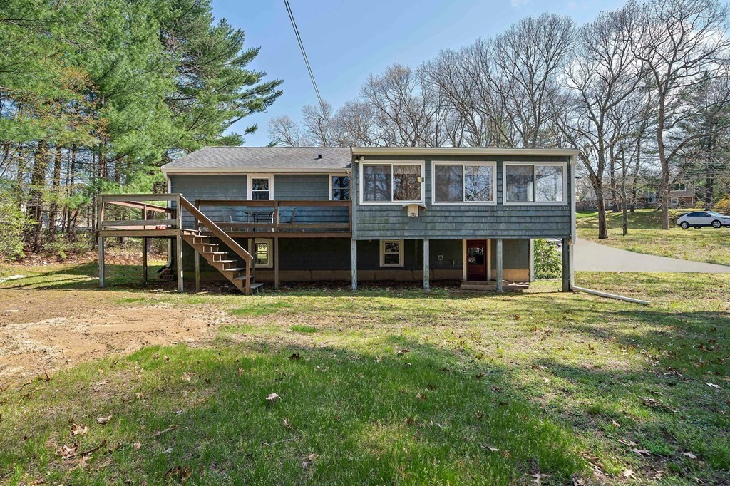 61 Orchard Road Marshfield, MA 02050 - Photo 28 of 33 a view of a yard in front of a house with large trees