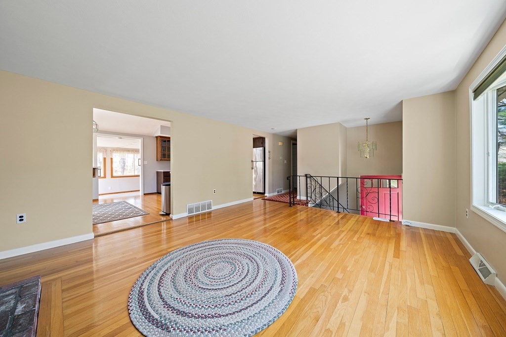 61 Orchard Road Marshfield, MA 02050 - Photo 5 of 33 a view of a bedroom with wooden floor and window