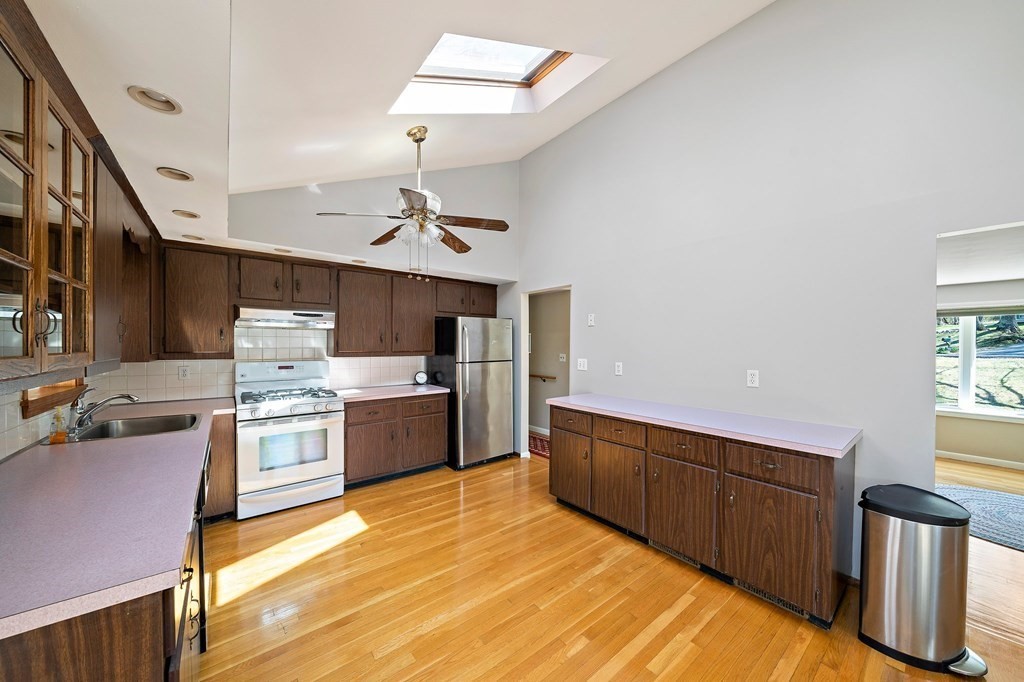 61 Orchard Road Marshfield, MA 02050 - Photo 10 of 33 a large kitchen with lots of counter space and wooden floor
