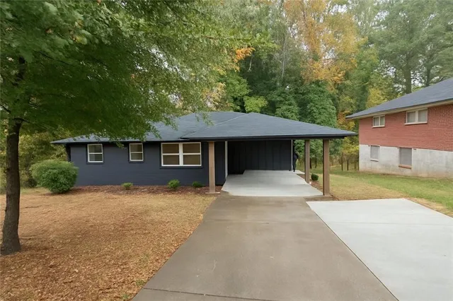 front view of a house with a yard