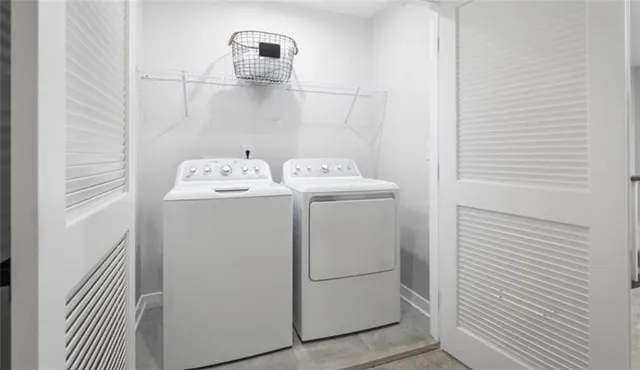 a utility room with dryer and washer