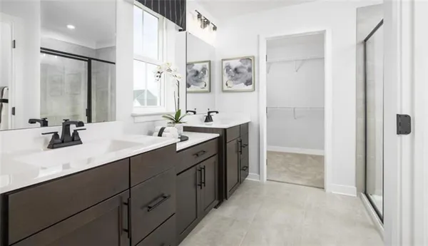 a bathroom with a double vanity sink mirror and double