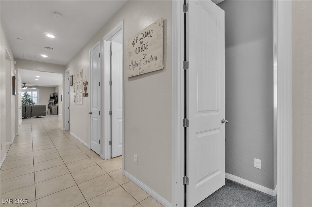 119 Mosso Niente Place Henderson, NV 89011 - Photo 18 of 36 Hallway featuring light tile patterned floors and recessed lighting