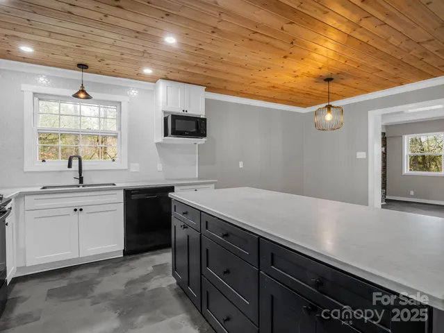 a kitchen with a sink and cabinets