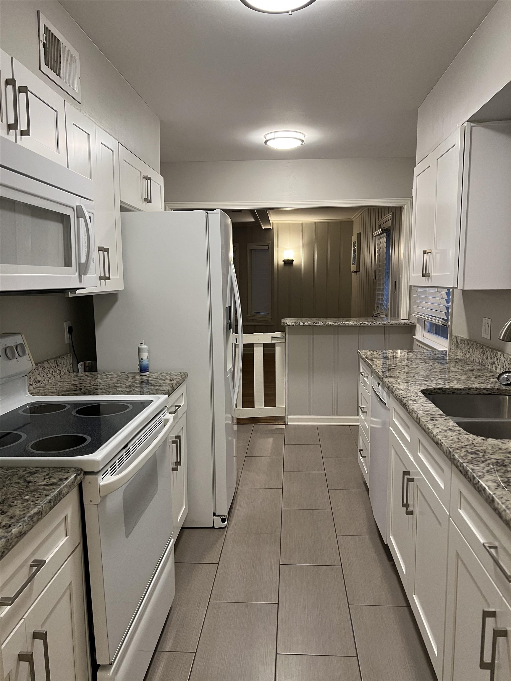 1653 Colonial Road Memphis, TN 38117 - Photo 7 of 15 a kitchen with a sink and a stove top oven