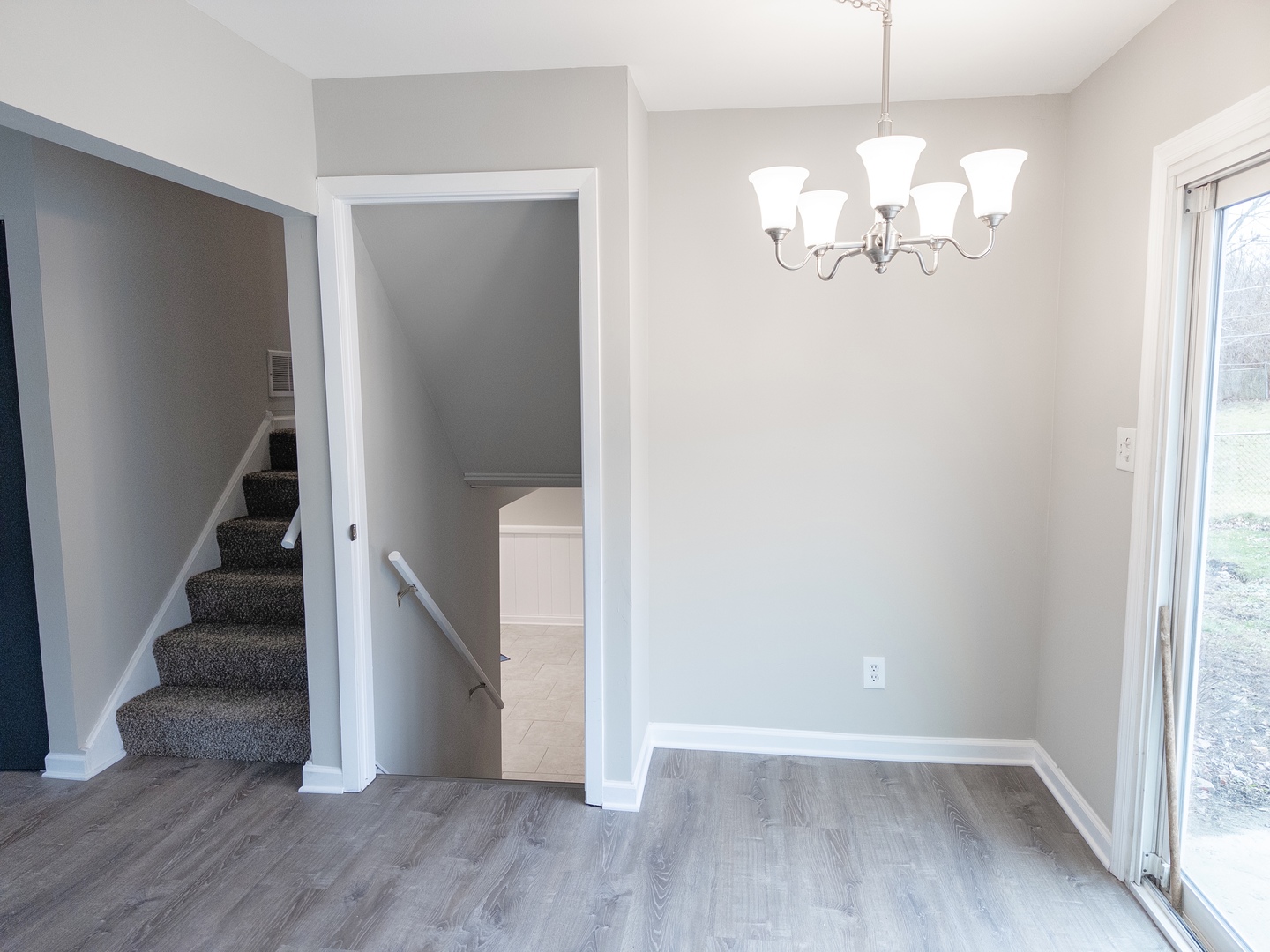 219 Riverside Drive Bolingbrook, IL 60440 - Photo 8 of 22 wooden floor in an empty room with a window