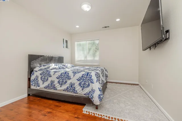 a white bath tub sitting next to a shower