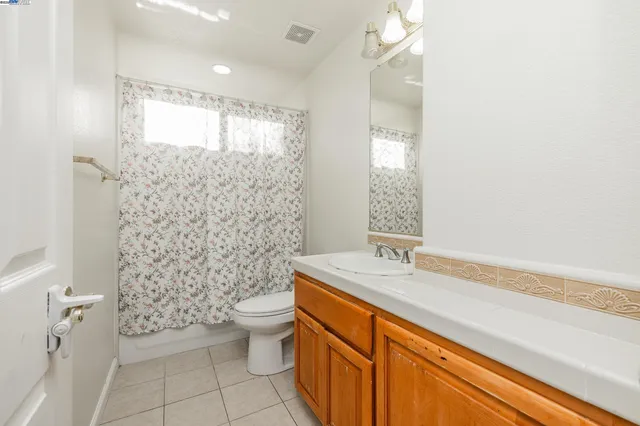 a bedroom with a bed and a shower