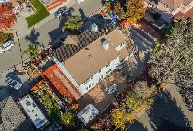 front view of a house with a tree