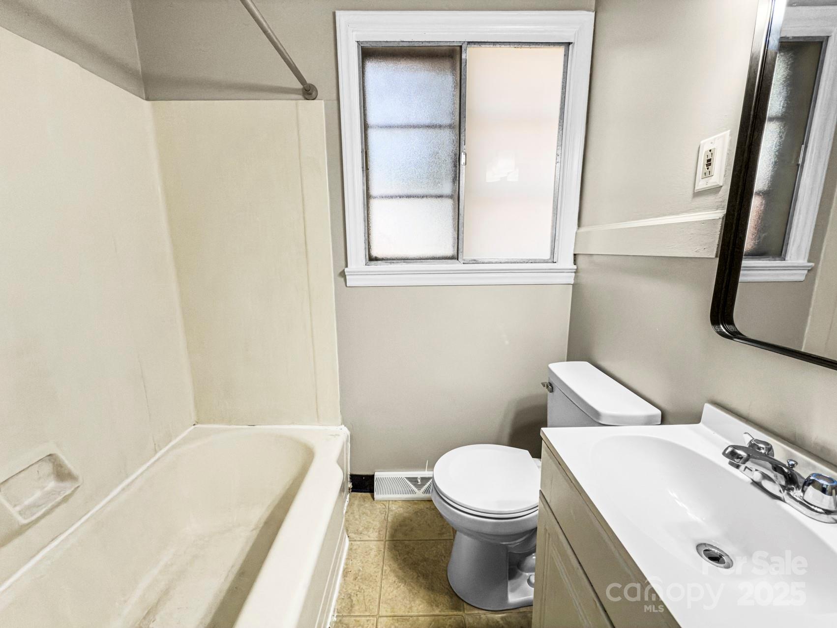 3014 Marlborough Road Charlotte, NC 28208 - Photo 14 of 20 a bathroom with a sink and a bathtub