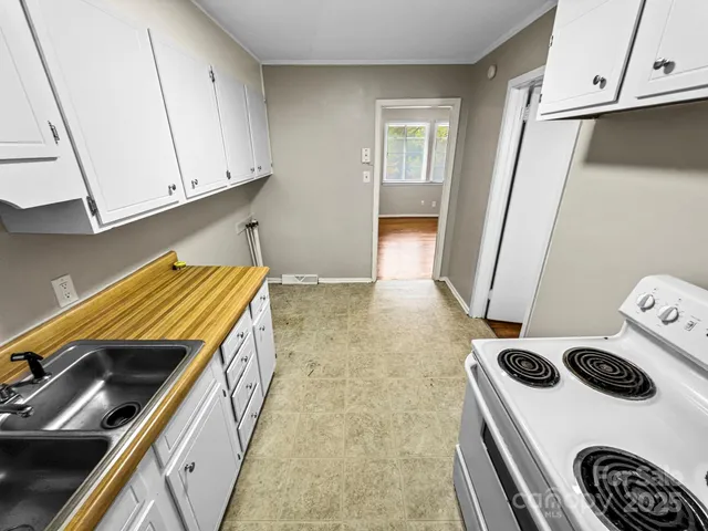 a kitchen with a stove and a microwave