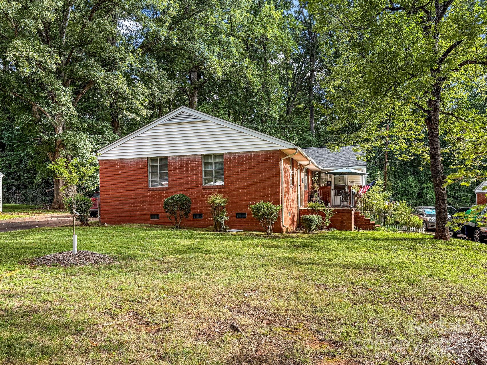 3014 Marlborough Road Charlotte, NC 28208 - Photo 18 of 20 a front view of a house with a yard