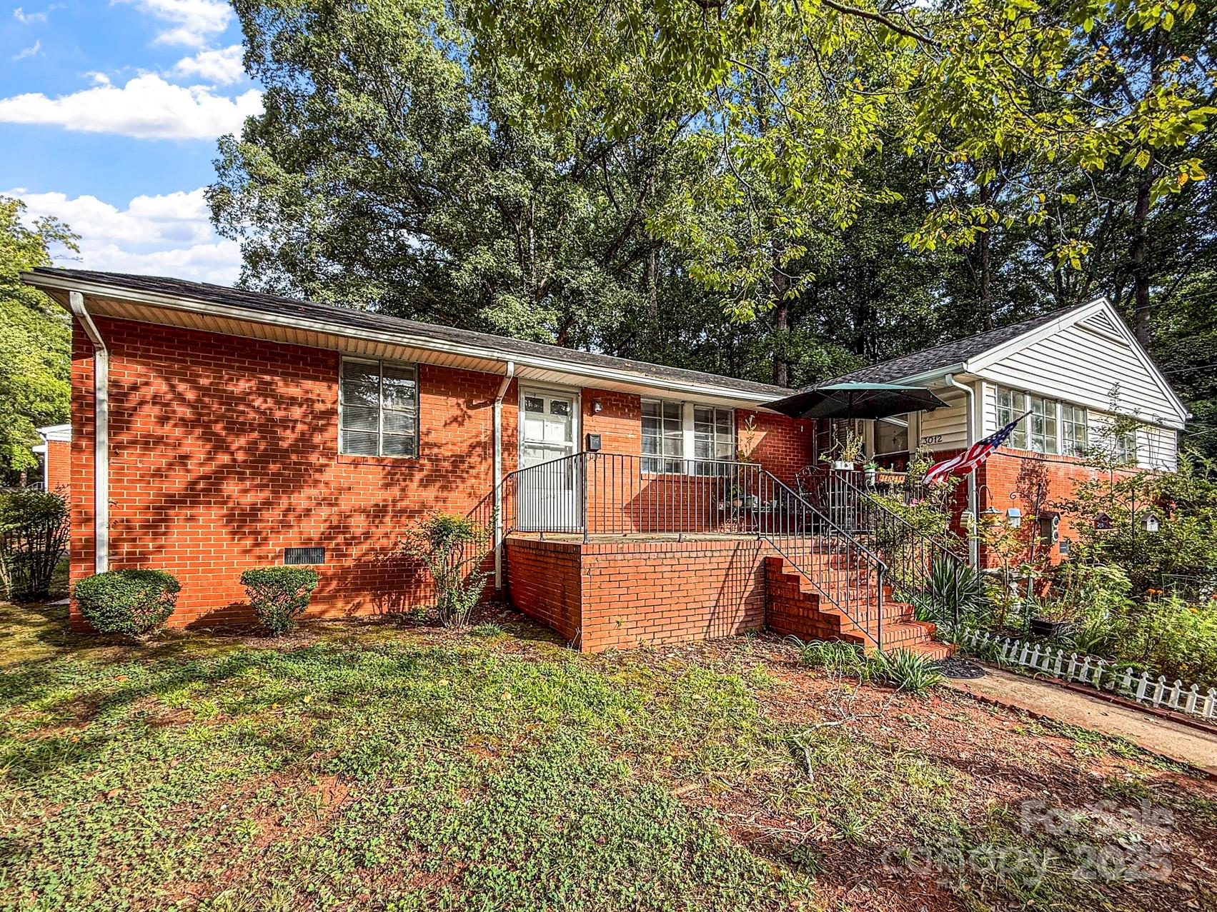 3014 Marlborough Road Charlotte, NC 28208 - Photo 19 of 20 a front view of a house with garden