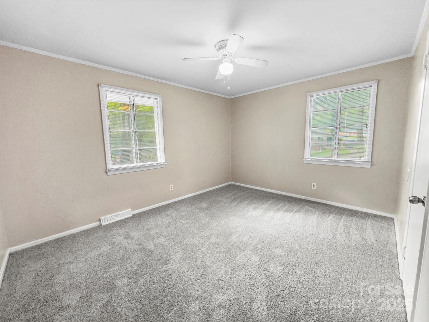 3014 Marlborough Road Charlotte, NC 28208 - Photo 4 of 20 an empty room with windows and closet