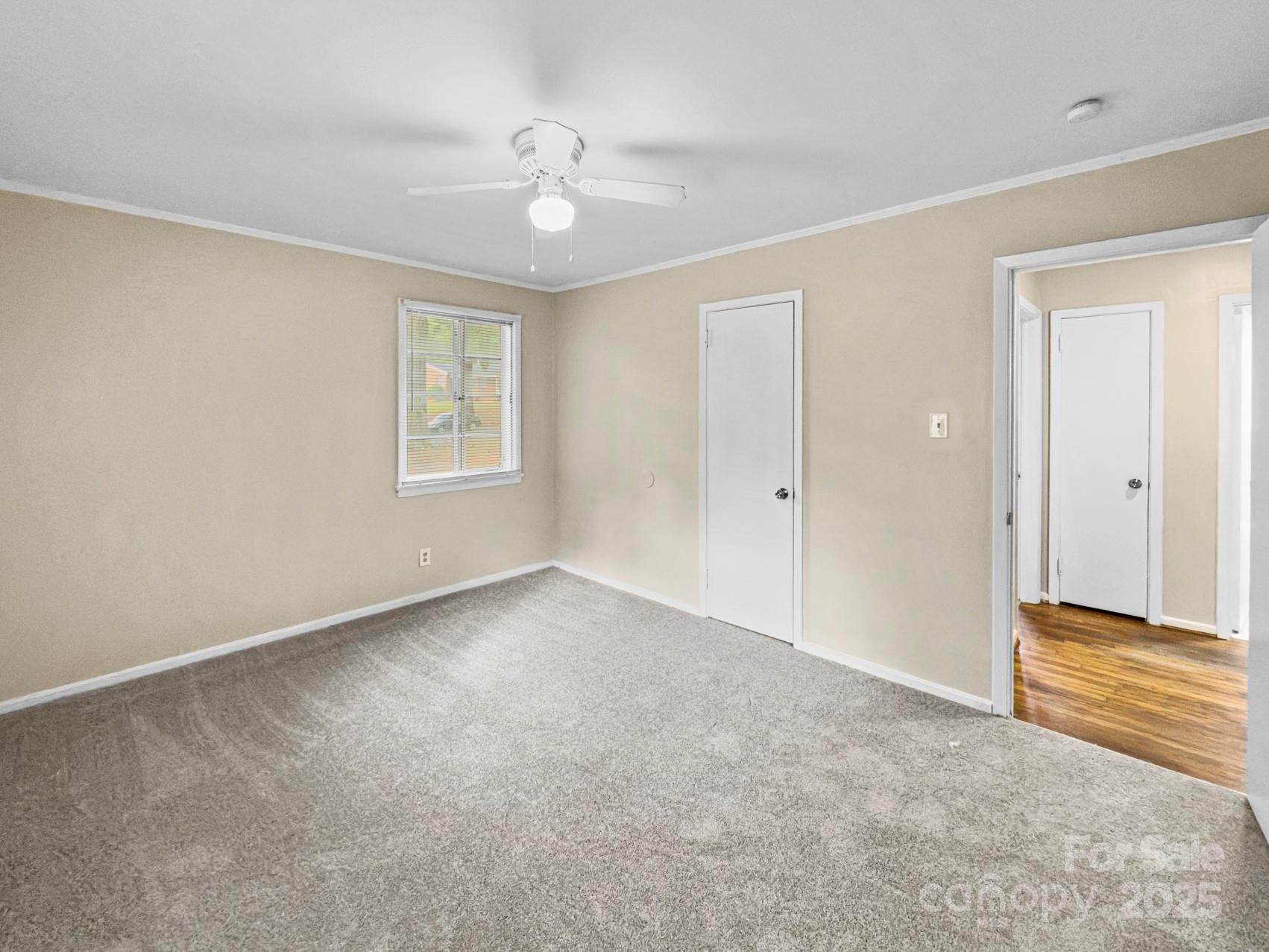 3014 Marlborough Road Charlotte, NC 28208 - Photo 6 of 20 a view of an empty room with a window