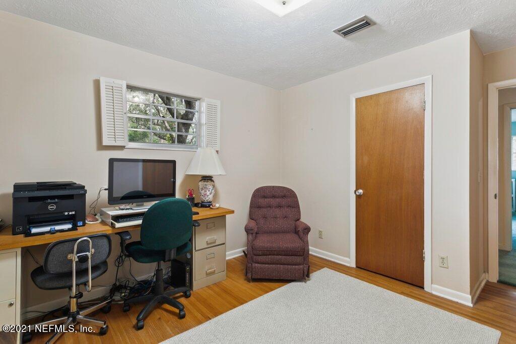 5434 Sanders Road Jacksonville, FL 32277 - Photo 15 of 31 Bedroom 2 with Floors Exposed
