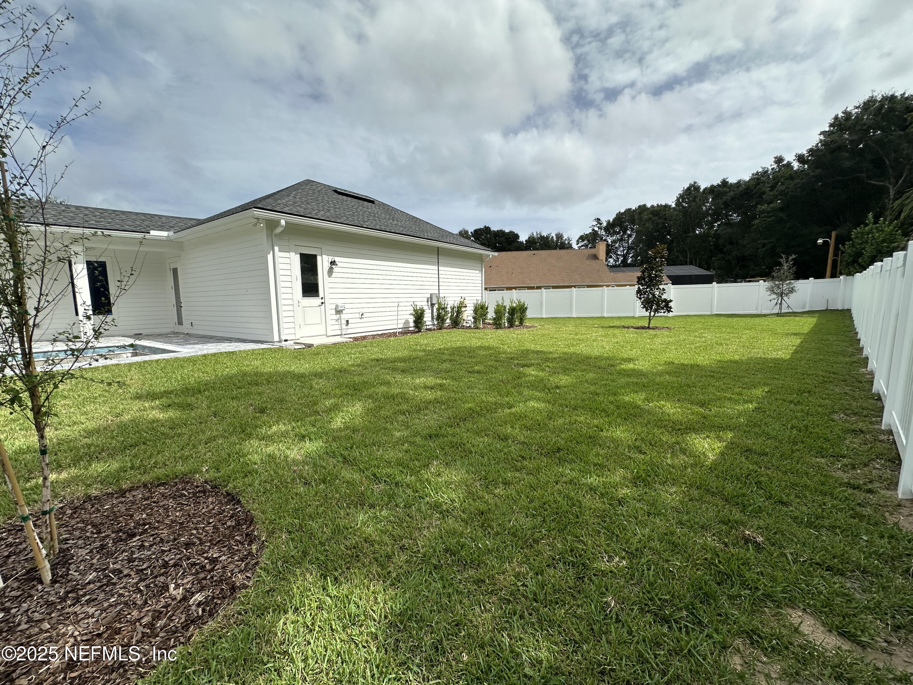 809 Brandywine Court St. Augustine, FL 32086 - Photo 45 of 63 a front view of a house with garden