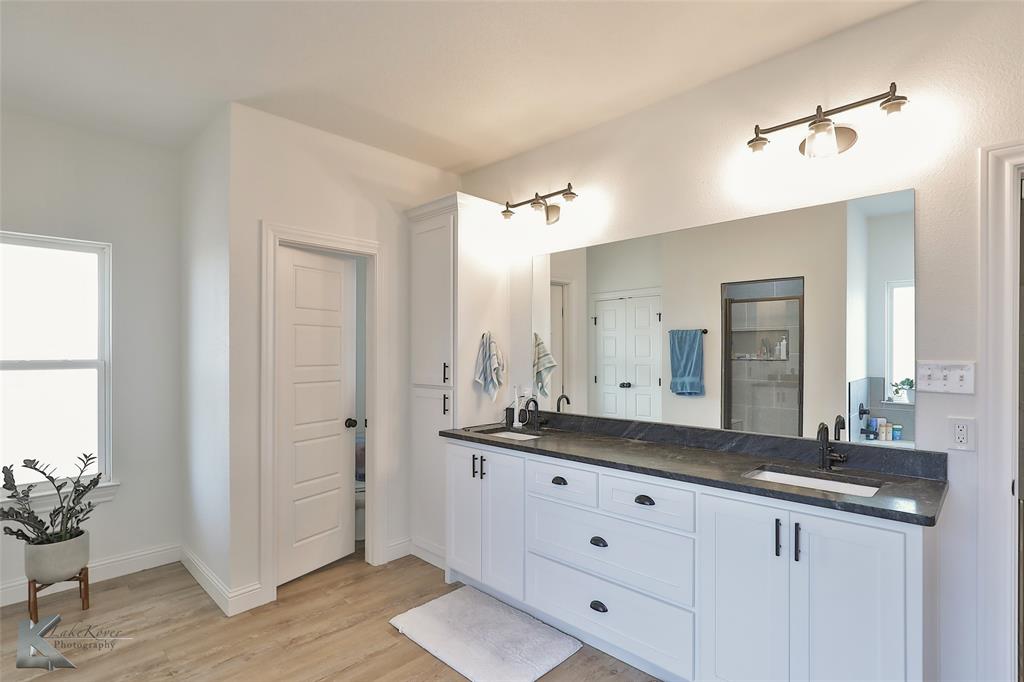 243 Beechcraft Abilene, TX 79602 - Photo 14 of 33 a bathroom with a granite countertop sink and a mirror