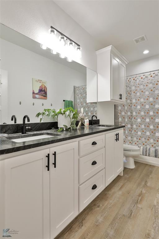 243 Beechcraft Abilene, TX 79602 - Photo 20 of 33 a kitchen with stainless steel appliances a sink a stove a refrigerator and cabinets