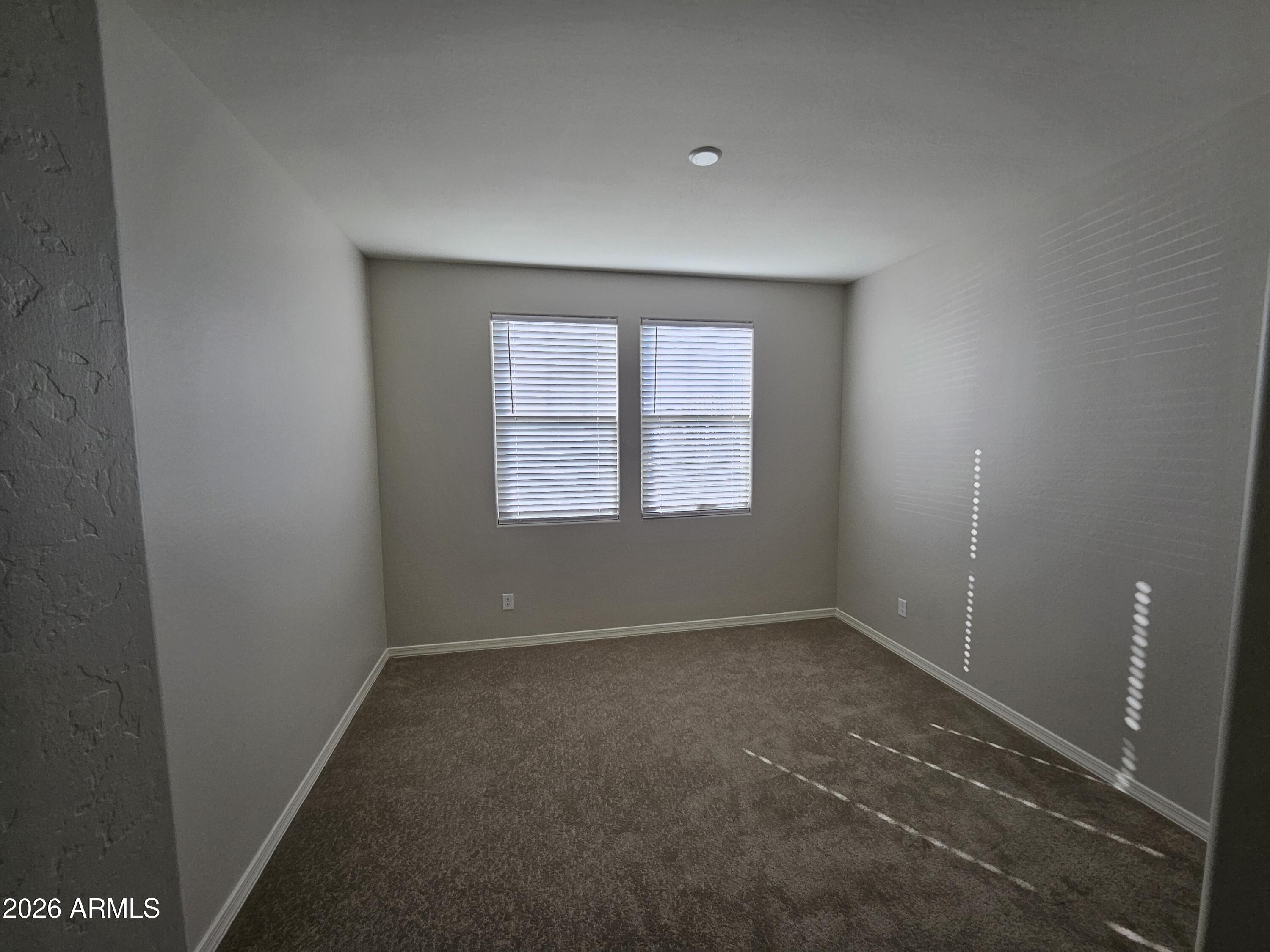 3010 East Augusta Avenue Gilbert, AZ 85298 - Photo 12 of 33 an empty room with windows