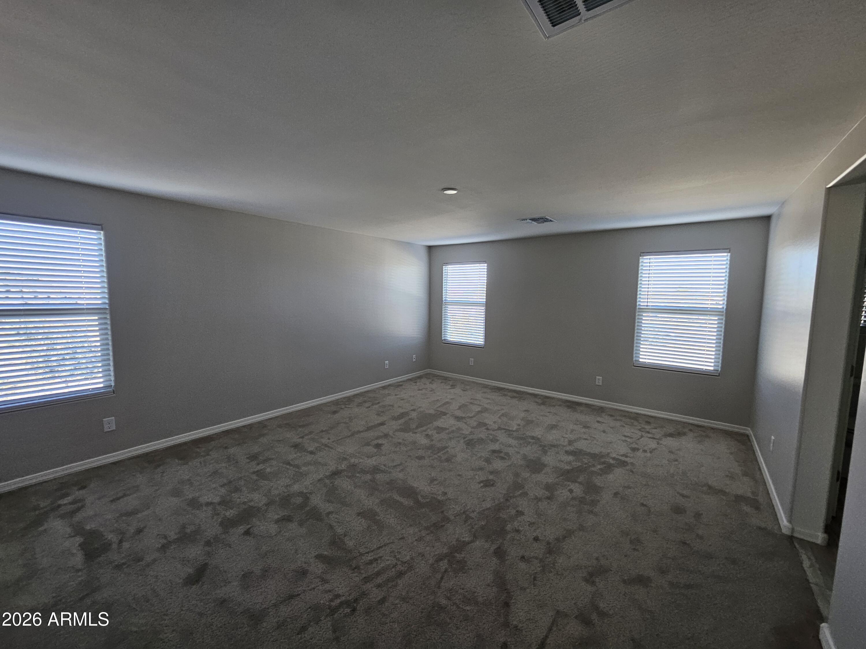 3010 East Augusta Avenue Gilbert, AZ 85298 - Photo 17 of 33 an empty room with windows