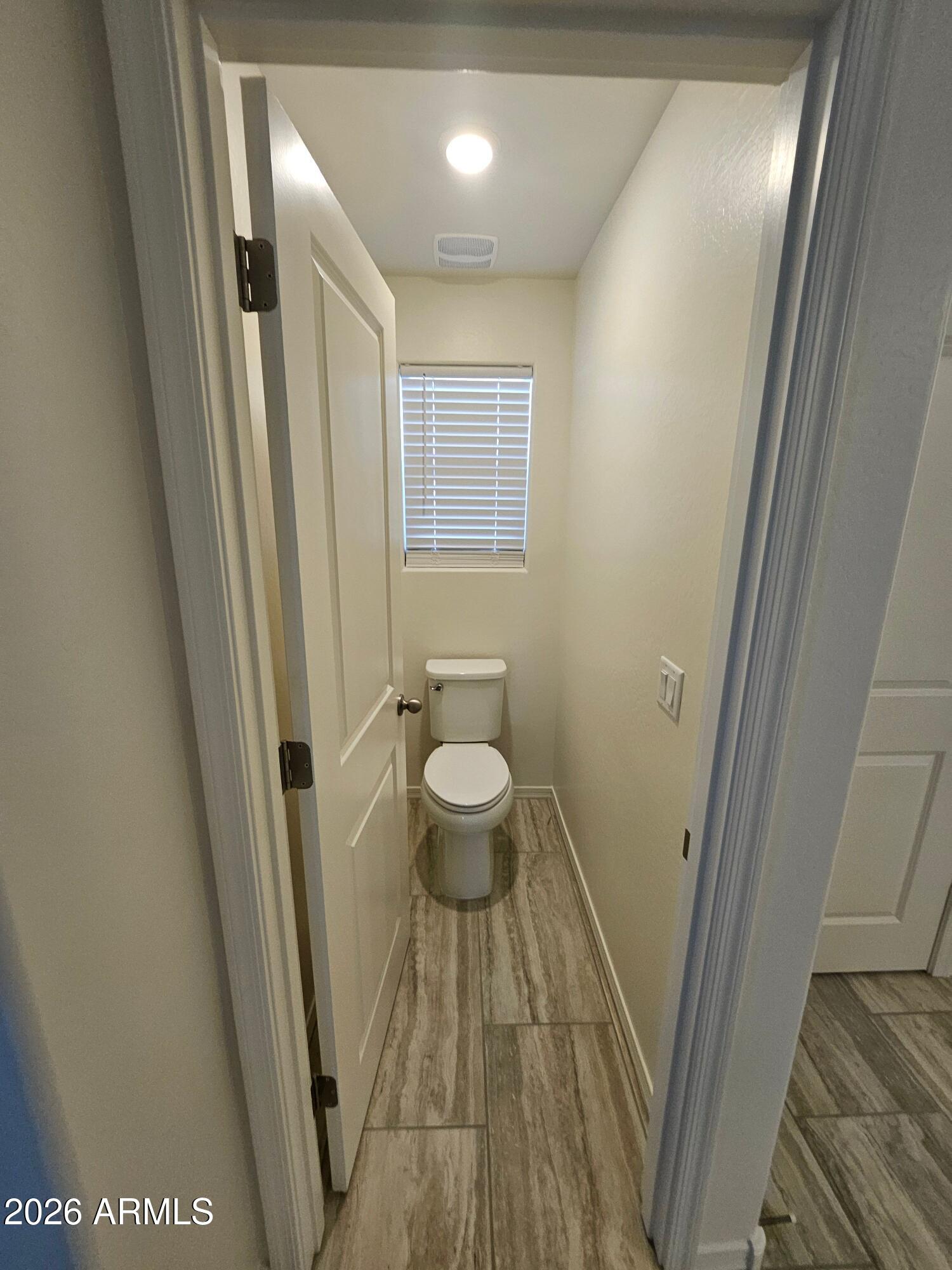 3010 East Augusta Avenue Gilbert, AZ 85298 - Photo 20 of 33 a bathroom with a sink a toilet a shower and a mirror