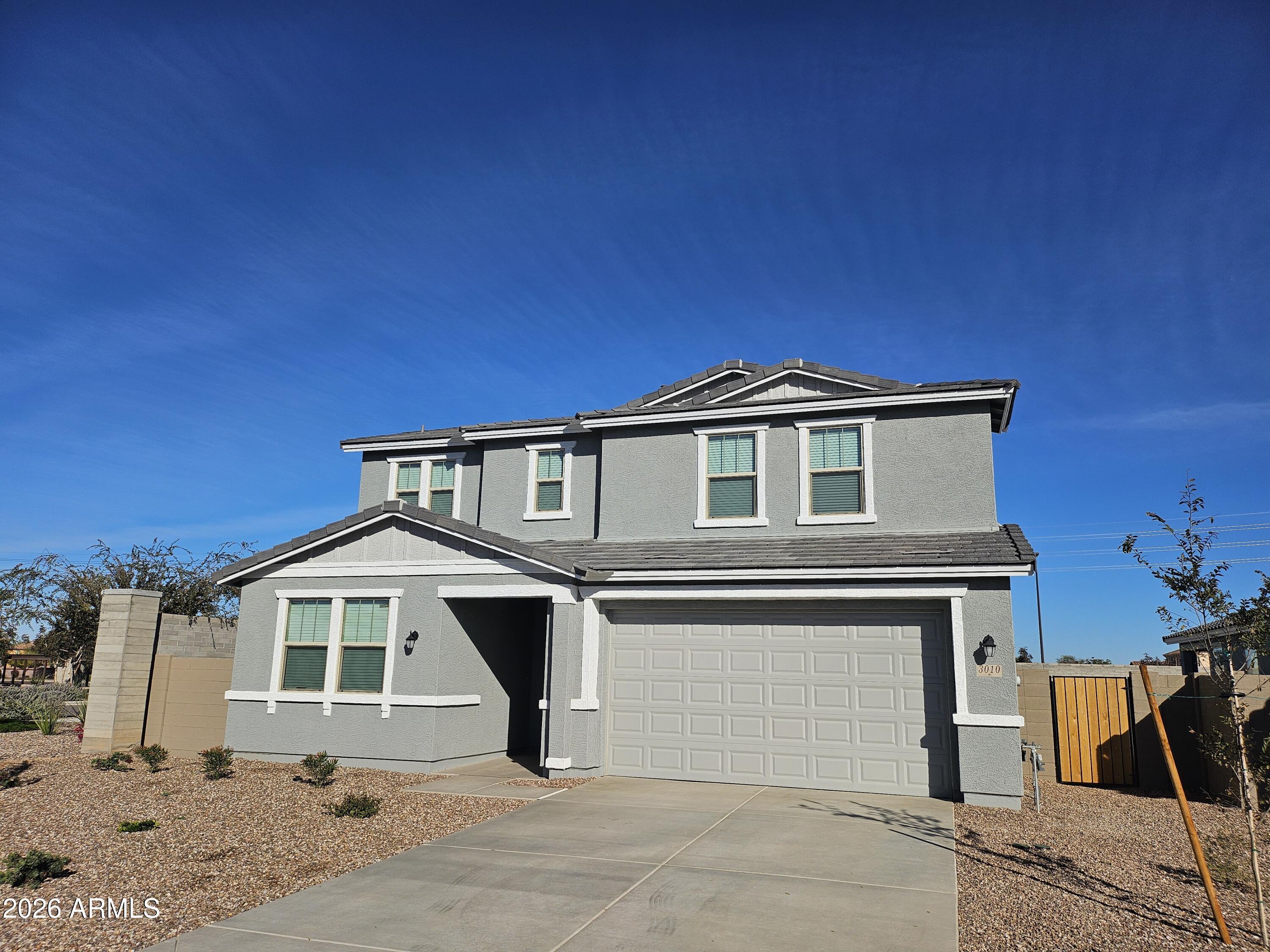 3010 East Augusta Avenue Gilbert, AZ 85298 - Photo 2 of 33 a front view of a house with a yard