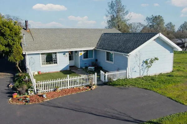 an aerial view of a house with a garden