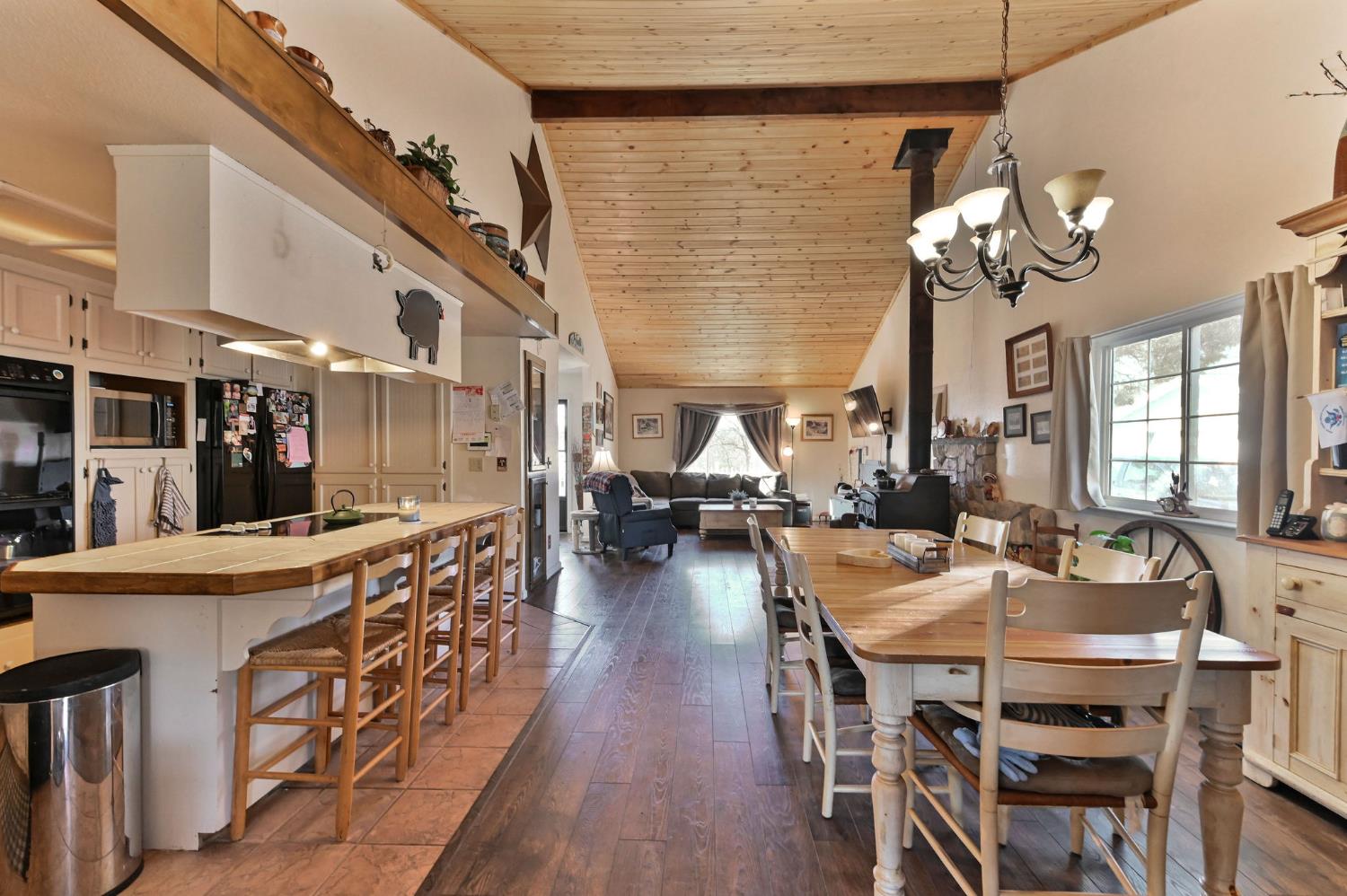 3653 Chuckwagon Drive Copperopolis, CA 95228 - Photo 11 of 73 a view of a dining room with furniture wooden floor and chandelier