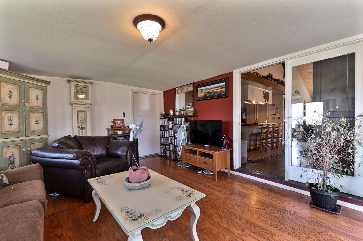 3653 Chuckwagon Drive Copperopolis, CA 95228 - Photo 14 of 73 a living room with furniture and a flat screen tv