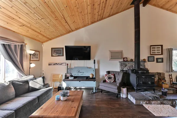 a bedroom with a bed and ceiling fan