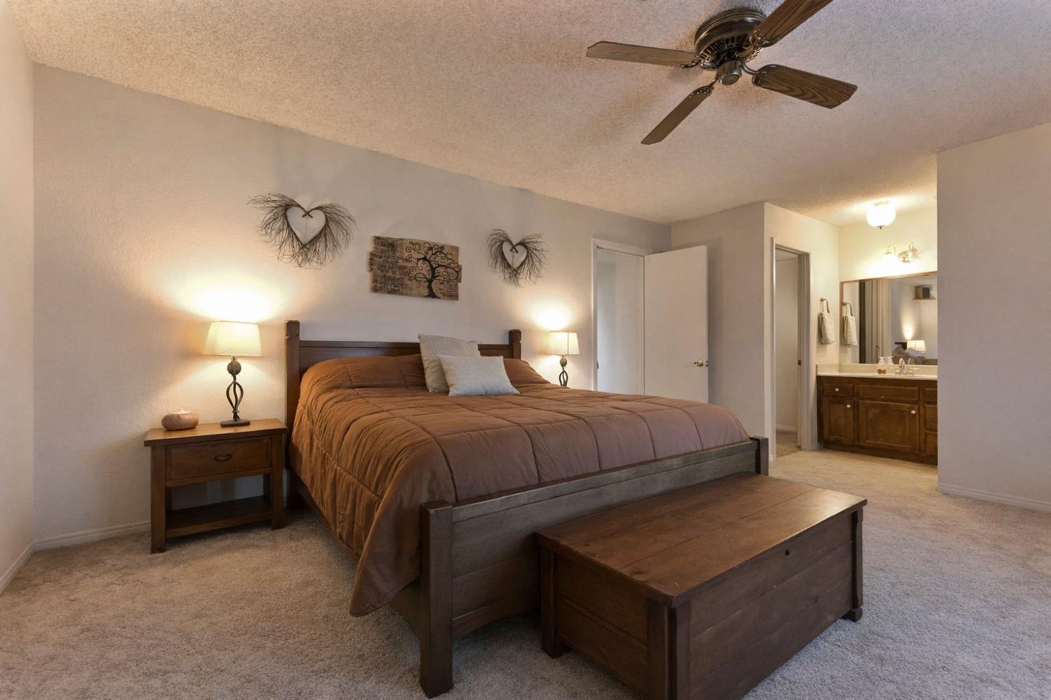 3653 Chuckwagon Drive Copperopolis, CA 95228 - Photo 22 of 73 a bedroom with a bed and ceiling fan