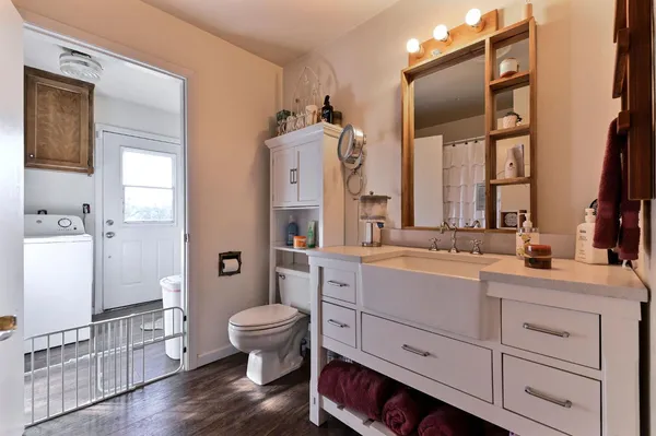 a bathroom with a sink a mirror and a shower
