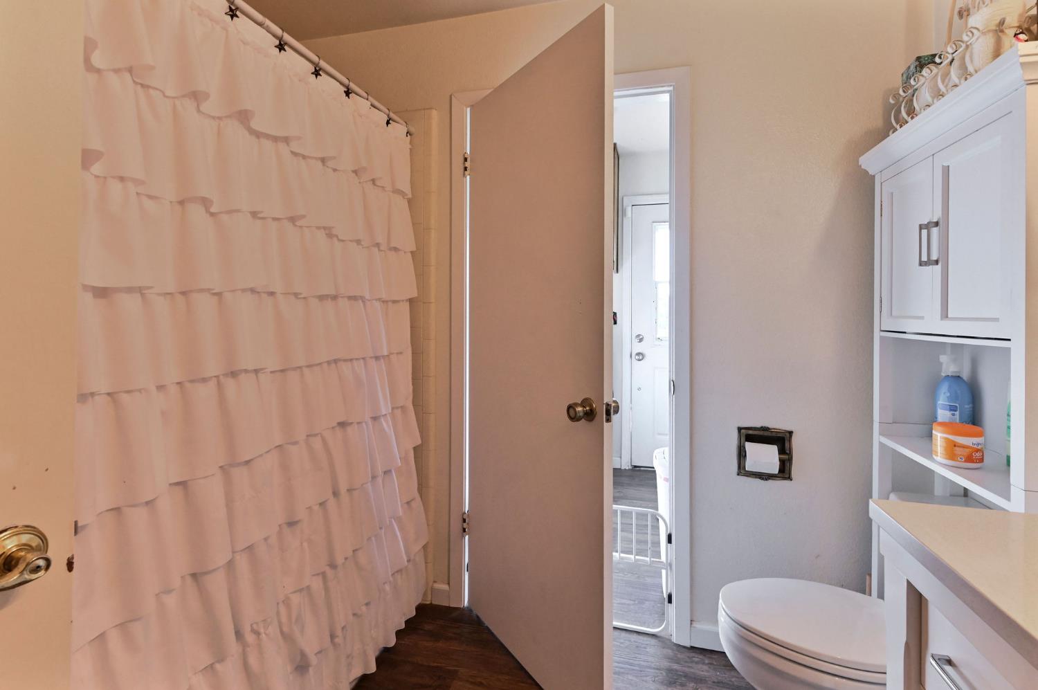 3653 Chuckwagon Drive Copperopolis, CA 95228 - Photo 27 of 73 a bathroom with a toilet and a shower