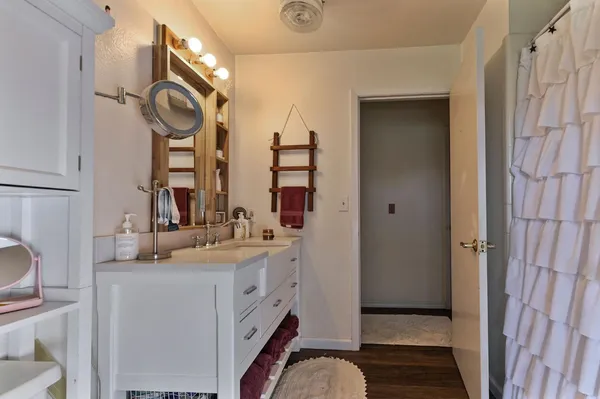 a front view of house with yard and trees in the background